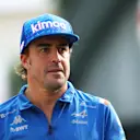 SINGAPORE, SINGAPORE - SEPTEMBER 30: Fernando Alonso of Spain and Alpine F1 walks in the Paddock prior to practice ahead of the F1 Grand Prix of Singapore at Marina Bay Street Circuit on September 30, 2022 in Singapore, Singapore. (Photo by Clive Rose/Getty Images,)