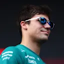 SINGAPORE, SINGAPORE - SEPTEMBER 30: Lance Stroll of Canada and Aston Martin F1 Team greets fans on the fan stage prior to practice ahead of the F1 Grand Prix of Singapore at Marina Bay Street Circuit on September 30, 2022 in Singapore, Singapore. (Photo by Dan Istitene - Formula 1/Formula 1 via Getty Images)