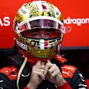 SINGAPORE, SINGAPORE - SEPTEMBER 30: Charles Leclerc of Monaco and Ferrari prepares to drive in the garage during practice ahead of the F1 Grand Prix of Singapore at Marina Bay Street Circuit on September 30, 2022 in Singapore, Singapore. (Photo by Clive Rose/Getty Images,)