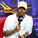 SINGAPORE, SINGAPORE - OCTOBER 01: Third placed qualifier Lewis Hamilton of Great Britain and Mercedes attends the press conference after qualifying ahead of the F1 Grand Prix of Singapore at Marina Bay Street Circuit on October 01, 2022 in Singapore, Singapore. (Photo by Dan Istitene/Getty Images)