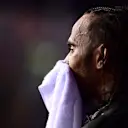 SINGAPORE, SINGAPORE - OCTOBER 01: Third placed qualifier Lewis Hamilton of Great Britain and Mercedes wipes his face with a towel in parc ferme during qualifying ahead of the F1 Grand Prix of Singapore at Marina Bay Street Circuit on October 01, 2022 in Singapore, Singapore. (Photo by Mario Renzi - Formula 1/Formula 1 via Getty Images)