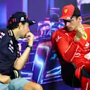 SINGAPORE, SINGAPORE - OCTOBER 01: Pole position qualifier Charles Leclerc of Monaco and Ferrari and Second placed qualifier Sergio Perez of Mexico and Oracle Red Bull Racing talk in the press conference after qualifying ahead of the F1 Grand Prix of Singapore at Marina Bay Street Circuit on October 01, 2022 in Singapore, Singapore. (Photo by Dan Istitene/Getty Images)