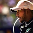 SINGAPORE, SINGAPORE - OCTOBER 01: Third placed qualifier Lewis Hamilton of Great Britain and Mercedes takes a drink in parc ferme during qualifying ahead of the F1 Grand Prix of Singapore at Marina Bay Street Circuit on October 01, 2022 in Singapore, Singapore. (Photo by Mario Renzi - Formula 1/Formula 1 via Getty Images)