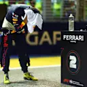SINGAPORE, SINGAPORE - OCTOBER 01: Second placed qualifier Sergio Perez of Mexico and Oracle Red Bull Racing wipes his head with a towel in parc ferme during qualifying ahead of the F1 Grand Prix of Singapore at Marina Bay Street Circuit on October 01, 2022 in Singapore, Singapore. (Photo by Dan Istitene - Formula 1/Formula 1 via Getty Images)