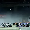 SINGAPORE, SINGAPORE - OCTOBER 02: Pierre Gasly of France driving the (10) Scuderia AlphaTauri AT03 leads Fernando Alonso of Spain driving the (14) Alpine F1 A522 Renault during the F1 Grand Prix of Singapore at Marina Bay Street Circuit on October 02, 2022 in Singapore, Singapore. (Photo by Dan Istitene - Formula 1/Formula 1 via Getty Images)