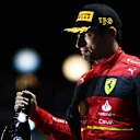 SINGAPORE, SINGAPORE - OCTOBER 02: Third placed Carlos Sainz of Spain and Ferrari celebrates on the podium during the F1 Grand Prix of Singapore at Marina Bay Street Circuit on October 02, 2022 in Singapore, Singapore. (Photo by Dan Istitene - Formula 1/Formula 1 via Getty Images)