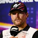 SINGAPORE, SINGAPORE - SEPTEMBER 29: Valtteri Bottas of Finland and Alfa Romeo F1 attends the Drivers Press Conference during previews ahead of the F1 Grand Prix of Singapore at Marina Bay Street Circuit on September 29, 2022 in Singapore, Singapore. (Photo by Clive Mason/Getty Images,)