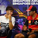 SINGAPORE, SINGAPORE - SEPTEMBER 29: Pierre Gasly of France and Scuderia AlphaTauri and Carlos Sainz of Spain and Ferrari talk in the Drivers Press Conference during previews ahead of the F1 Grand Prix of Singapore at Marina Bay Street Circuit on September 29, 2022 in Singapore, Singapore. (Photo by Clive Mason/Getty Images,)