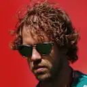 BARCELONA, SPAIN - MAY 21: Sebastian Vettel of Germany and Aston Martin F1 Team walks in the Paddock prior to practice ahead of the F1 Grand Prix of Spain at Circuit de Barcelona-Catalunya on May 21, 2022 in Barcelona, Spain. (Photo by Bryn Lennon - Formula 1/Formula 1 via Getty Images)