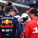 BARCELONA, SPAIN - MAY 21: Pole position qualifier Charles Leclerc of Monaco and Ferrari and Second placed qualifier Max Verstappen of the Netherlands and Oracle Red Bull Racing talk in parc ferme during qualifying ahead of the F1 Grand Prix of Spain at Circuit de Barcelona-Catalunya on May 21, 2022 in Barcelona, Spain. (Photo by Dan Istitene - Formula 1/Formula 1 via Getty Images)