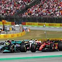 BARCELONA, SPAIN - MAY 22: Lewis Hamilton of Great Britain driving the (44) Mercedes AMG Petronas F1 Team W13 leads Carlos Sainz of Spain driving (55) the Ferrari F1-75 during the F1 Grand Prix of Spain at Circuit de Barcelona-Catalunya on May 22, 2022 in Barcelona, Spain. (Photo by Joe Portlock - Formula 1/Formula 1 via Getty Images)