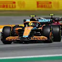 BARCELONA, SPAIN - MAY 22: Lando Norris of Great Britain driving the (4) McLaren MCL36 Mercedes leads Carlos Sainz of Spain driving (55) the Ferrari F1-75 during the F1 Grand Prix of Spain at Circuit de Barcelona-Catalunya on May 22, 2022 in Barcelona, Spain. (Photo by Joe Portlock - Formula 1/Formula 1 via Getty Images)