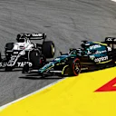 BARCELONA, SPAIN - MAY 22: Pierre Gasly of France driving the (10) Scuderia AlphaTauri AT03 and Lance Stroll of Canada driving the (18) Aston Martin AMR22 Mercedes battle for track position during the F1 Grand Prix of Spain at Circuit de Barcelona-Catalunya on May 22, 2022 in Barcelona, Spain. (Photo by Lars Baron/Getty Images)