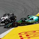 BARCELONA, SPAIN - MAY 22: Pierre Gasly of France driving the (10) Scuderia AlphaTauri AT03 and Lance Stroll of Canada driving the (18) Aston Martin AMR22 Mercedes battle for track position during the F1 Grand Prix of Spain at Circuit de Barcelona-Catalunya on May 22, 2022 in Barcelona, Spain. (Photo by Lars Baron/Getty Images)