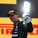 BARCELONA, SPAIN - MAY 22: Third placed George Russell of Great Britain and Mercedes celebrates on the podium during the F1 Grand Prix of Spain at Circuit de Barcelona-Catalunya on May 22, 2022 in Barcelona, Spain. (Photo by Alex Pantling - Formula 1/Formula 1 via Getty Images)