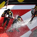 BARCELONA, SPAIN - MAY 22: Race winner Max Verstappen of the Netherlands and Oracle Red Bull Racing, Second placed Sergio Perez of Mexico and Oracle Red Bull Racing and Third placed George Russell of Great Britain and Mercedes celebrate on the podium during the F1 Grand Prix of Spain at Circuit de Barcelona-Catalunya on May 22, 2022 in Barcelona, Spain. (Photo by Lars Baron/Getty Images)