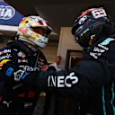 BARCELONA, SPAIN - MAY 22: Race winner Max Verstappen of the Netherlands and Oracle Red Bull Racing interacts with third placed George Russell of Great Britain and Mercedes in parc ferme during the F1 Grand Prix of Spain at Circuit de Barcelona-Catalunya on May 22, 2022 in Barcelona, Spain. (Photo by Mark Thompson/Getty Images)