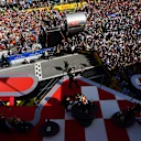 BARCELONA, SPAIN - MAY 22: Race winner Max Verstappen of the Netherlands and Oracle Red Bull Racing, Second placed Sergio Perez of Mexico and Oracle Red Bull Racing and Third placed George Russell of Great Britain and Mercedes celebrate on the podium during the F1 Grand Prix of Spain at Circuit de Barcelona-Catalunya on May 22, 2022 in Barcelona, Spain. (Photo by Mario Renzi - Formula 1/Formula 1 via Getty Images)