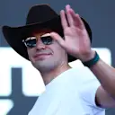 AUSTIN, TEXAS - OCTOBER 21: Lance Stroll of Canada and Aston Martin F1 Team greets the crowd on the fan stage prior to practice ahead of the F1 Grand Prix of USA at Circuit of The Americas on October 21, 2022 in Austin, Texas. (Photo by Dan Istitene - Formula 1/Formula 1 via Getty Images)