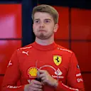 AUSTIN, TEXAS - OCTOBER 21: Robert Shwartzman of Israel and Ferrari looks on from the garage during practice ahead of the F1 Grand Prix of USA at Circuit of The Americas on October 21, 2022 in Austin, Texas. (Photo by Chris Graythen/Getty Images)