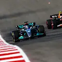 AUSTIN, TEXAS - OCTOBER 21: George Russell of Great Britain driving the (63) Mercedes AMG Petronas F1 Team W13 leads Sergio Perez of Mexico driving the (11) Oracle Red Bull Racing RB18 during practice ahead of the F1 Grand Prix of USA at Circuit of The Americas on October 21, 2022 in Austin, Texas. (Photo by Dan Istitene - Formula 1/Formula 1 via Getty Images)