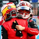 AUSTIN, TEXAS - OCTOBER 22: Pole position qualifier Carlos Sainz of Spain and Ferrari and Second placed qualifier Charles Leclerc of Monaco and Ferrari celebrate in parc ferme during qualifying ahead of the F1 Grand Prix of USA at Circuit of The Americas on October 22, 2022 in Austin, Texas. (Photo by Mark Thompson/Getty Images )