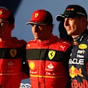 AUSTIN, TEXAS - OCTOBER 22: Pole position qualifier Carlos Sainz of Spain and Ferrari (C), Second placed qualifier Charles Leclerc of Monaco and Ferrari (L) and Third placed qualifier Max Verstappen of the Netherlands and Oracle Red Bull Racing (R) pose for a photo in parc ferme during qualifying ahead of the F1 Grand Prix of USA at Circuit of The Americas on October 22, 2022 in Austin, Texas. (Photo by Dan Istitene - Formula 1/Formula 1 via Getty Images)