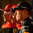 AUSTIN, TEXAS - OCTOBER 22: Pole position qualifier Carlos Sainz of Spain and Ferrari (C), Second placed qualifier Charles Leclerc of Monaco and Ferrari (L) and Third placed qualifier Max Verstappen of the Netherlands and Oracle Red Bull Racing (R) pose for a photo in parc ferme during qualifying ahead of the F1 Grand Prix of USA at Circuit of The Americas on October 22, 2022 in Austin, Texas. (Photo by Mario Renzi - Formula 1/Formula 1 via Getty Images)
