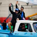 AUSTIN, TEXAS - OCTOBER 23: Fernando Alonso of Spain and Alpine F1 and Esteban Ocon of France and Alpine F1 wave to the crowd on the drivers parade prior to the F1 Grand Prix of USA at Circuit of The Americas on October 23, 2022 in Austin, Texas. (Photo by Chris Graythen/Getty Images)