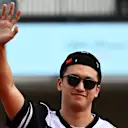AUSTIN, TEXAS - OCTOBER 23: Zhou Guanyu of China and Alfa Romeo F1 waves to the crowd on the drivers parade prior to the F1 Grand Prix of USA at Circuit of The Americas on October 23, 2022 in Austin, Texas. (Photo by Clive Mason - Formula 1/Formula 1 via Getty Images)