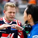 AUSTIN, TEXAS - OCTOBER 23: Kevin Magnussen of Denmark and Haas F1 talks with Ayao Komatsu on the grid during the F1 Grand Prix of USA at Circuit of The Americas on October 23, 2022 in Austin, Texas. (Photo by Chris Graythen/Getty Images)