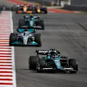 AUSTIN, TEXAS - OCTOBER 23: Lance Stroll of Canada driving the (18) Aston Martin AMR22 Mercedes leads George Russell of Great Britain driving the (63) Mercedes AMG Petronas F1 Team W13 on track during the F1 Grand Prix of USA at Circuit of The Americas on October 23, 2022 in Austin, Texas. (Photo by Jared C. Tilton/Getty Images)