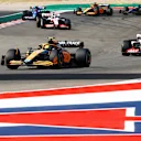 AUSTIN, TEXAS - OCTOBER 23: Lando Norris of Great Britain driving the (4) McLaren MCL36 Mercedes leads Mick Schumacher of Germany driving the (47) Haas F1 VF-22 Ferrari on track during the F1 Grand Prix of USA at Circuit of The Americas on October 23, 2022 in Austin, Texas. (Photo by Chris Graythen/Getty Images)