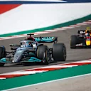 AUSTIN, TEXAS - OCTOBER 23: George Russell of Great Britain driving the (63) Mercedes AMG Petronas F1 Team W13 leads Sergio Perez of Mexico driving the (11) Oracle Red Bull Racing RB18 on trackduring the F1 Grand Prix of USA at Circuit of The Americas on October 23, 2022 in Austin, Texas. (Photo by Chris Graythen/Getty Images)