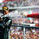 AUSTIN, TEXAS - OCTOBER 23: Second placed Lewis Hamilton of Great Britain and Mercedes celebrates on the podium following the F1 Grand Prix of USA at Circuit of The Americas on October 23, 2022 in Austin, Texas. (Photo by Dan Istitene - Formula 1/Formula 1 via Getty Images)