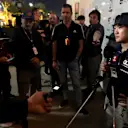 BAHRAIN, BAHRAIN - MARCH 03: Yuki Tsunoda of Japan and Scuderia AlphaTauri talks to the media in the Paddock after practice ahead of the F1 Grand Prix of Bahrain at Bahrain International Circuit on March 03, 2023 in Bahrain, Bahrain. (Photo by Peter Fox/Getty Images)