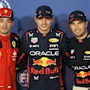 BAHRAIN, BAHRAIN - MARCH 04: Pole position qualifier Max Verstappen of the Netherlands and Oracle Red Bull Racing (C), Second placed qualifier Sergio Perez of Mexico and Oracle Red Bull Racing (R) and Third placed qualifier Charles Leclerc of Monaco and Ferrari (L) pose for a photo in parc ferme during qualifying ahead of the F1 Grand Prix of Bahrain at Bahrain International Circuit on March 04, 2023 in Bahrain, Bahrain. (Photo by Peter Fox/Getty Images)