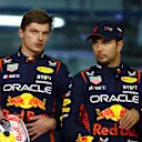 BAHRAIN, BAHRAIN - MARCH 04: Pole position qualifier Max Verstappen of the Netherlands and Oracle Red Bull Racing and Second placed qualifier Sergio Perez of Mexico and Oracle Red Bull Racing talk in parc ferme during qualifying ahead of the F1 Grand Prix of Bahrain at Bahrain International Circuit on March 04, 2023 in Bahrain, Bahrain. (Photo by Mark Thompson/Getty Images)
