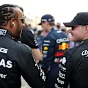 BAHRAIN, BAHRAIN - MARCH 05: Lewis Hamilton of Great Britain and Mercedes talks with Valtteri Bottas of Finland and Alfa Romeo F1 prior to the F1 Grand Prix of Bahrain at Bahrain International Circuit on March 05, 2023 in Bahrain, Bahrain. (Photo by Peter Fox/Getty Images)