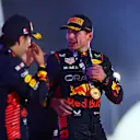 BAHRAIN, BAHRAIN - MARCH 05: Race winner Max Verstappen of the Netherlands and Oracle Red Bull Racing celebrates with team-mate Second placed Sergio Perez of Mexico and Oracle Red Bull Racing on the podium during the F1 Grand Prix of Bahrain at Bahrain International Circuit on March 05, 2023 in Bahrain, Bahrain. (Photo by Dan Istitene - Formula 1/Formula 1 via Getty Images)