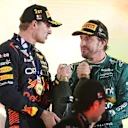 BAHRAIN, BAHRAIN - MARCH 05: Race winner Max Verstappen of the Netherlands and Oracle Red Bull Racing and Third placed Fernando Alonso of Spain and Aston Martin F1 Team celebrate on the podium during the F1 Grand Prix of Bahrain at Bahrain International Circuit on March 05, 2023 in Bahrain, Bahrain. (Photo by Peter Fox/Getty Images)