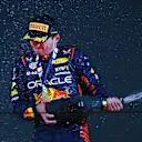 BAHRAIN, BAHRAIN - MARCH 05: Race winner Max Verstappen of the Netherlands and Oracle Red Bull Racing celebrates on the podium during the F1 Grand Prix of Bahrain at Bahrain International Circuit on March 05, 2023 in Bahrain, Bahrain. (Photo by Mark Thompson/Getty Images)