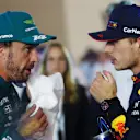 BAHRAIN, BAHRAIN - MARCH 05: Race winner Max Verstappen of the Netherlands and Oracle Red Bull Racing and Third placed Fernando Alonso of Spain and Aston Martin F1 Team talk in parc ferme during the F1 Grand Prix of Bahrain at Bahrain International Circuit on March 05, 2023 in Bahrain, Bahrain. (Photo by Bryn Lennon - Formula 1/Formula 1 via Getty Images)