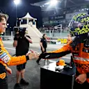 YAS MARINA CIRCUIT, UNITED ARAB EMIRATES - DECEMBER 07: Oscar Piastri, McLaren F1 Team, and pole man Lando Norris, McLaren F1 Team, congratulate each other in Parc Ferme during the Abu Dhabi GP at Yas Marina Circuit on Saturday December 07, 2024 in Abu Dhabi, United Arab Emirates. (Photo by Steven Tee / LAT Images)