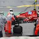 The car of Ferrari's Spanish driver Carlos Sainz is removed from the track after an accident during the qualifying session for the Formula One Sao Paulo Grand Prix, at the Jose Carlos Pace racetrack, aka Interlagos, in Sao Paulo, Brazil, on November 3, 2024. (Photo by Miguel Schincariol / AFP) (Photo by MIGUEL SCHINCARIOL/AFP via Getty Images)