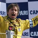 The German won again around the high-speed sweeps of Monza after a costly incident for Hakkinen