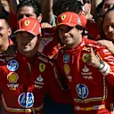(L-R) Ferrari's Monegasque driver Charles Leclerc, Ferrari's Spanish driver Carlos Sainz Jr. and Ferrari's French team principal FrÃ©dÃ©ric Vasseur celebrate with teammates after Leclerc won the United States Formula One Grand Prix at the Circuit of the Americas in Austin, Texas, on October 20, 2024. (Photo by Patrick T. Fallon / AFP) (Photo by PATRICK T. FALLON/AFP via Getty Images)
