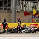 BAHRAIN, BAHRAIN - APRIL 12: Marshals assist Esteban Ocon of France and Haas F1 after a crash during qualifying ahead of the F1 Grand Prix of Bahrain at Bahrain International Circuit on April 12, 2025 in Bahrain, Bahrain. (Photo by Mark Sutton - Formula 1/Formula 1 via Getty Images)