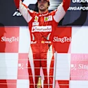 SINGAPORE - SEPTEMBER 26:  Fernando Alonso of Spain and Ferrari celebrates on the podium after