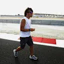 SAKHIR, BAHRAIN - MARCH 31:  Fernando Alonso of Spain and Renault walks the new cuicuit prior to